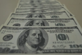 Dólar opera em queda com risco de 'shutdown' nos EUA